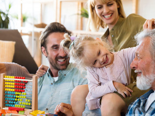 Cheerful multi-generation family having fun while spending time together at home.