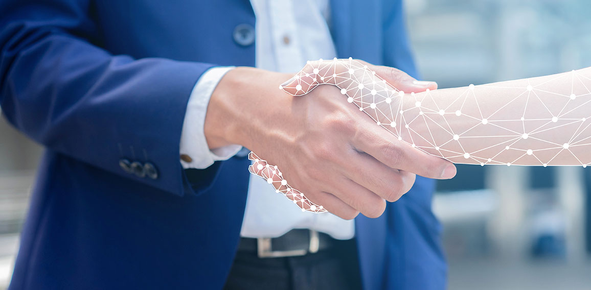 close up on businessman hand shaking with robotic AI hologram to