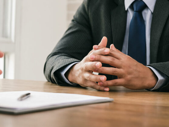 Businessman negotiating with client at the table before making an agreement
