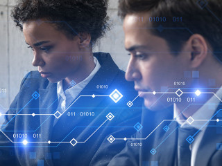 Two good looking businesspeople working together in office on IT project. Technology hologram drawings. Double exposure. Formal wear.