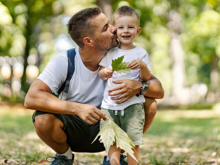 Summer time for family fun in the wood. Father and son dressed i