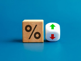 Percentage icon on wooden cube block and up and down arrow symbo