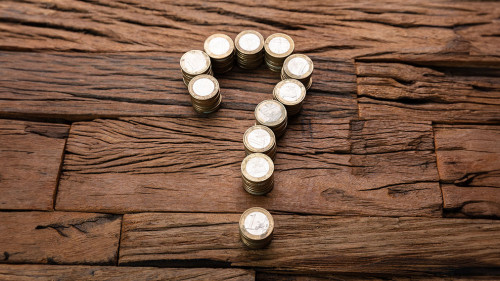 Stacked Coins Forming Question Mark