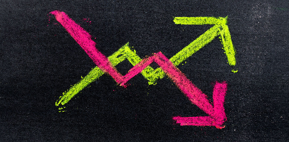 Hand drawing of green and red chalk in up and down arrow shape o