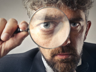 Man using a magnifier