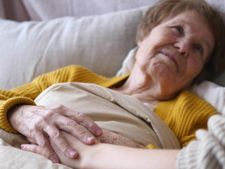 Family, Support, Elderly Care, Assistance, Seniors Concept. Grandmother In Bed.