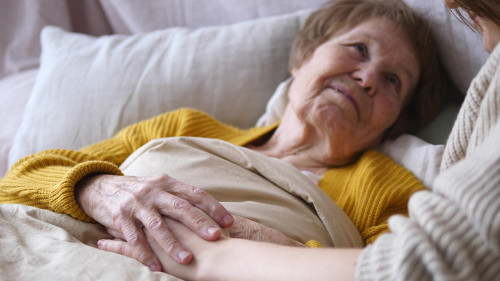 Family, Support, Elderly Care, Assistance, Seniors Concept. Grandmother In Bed.