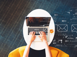 Email concept with person using a laptop