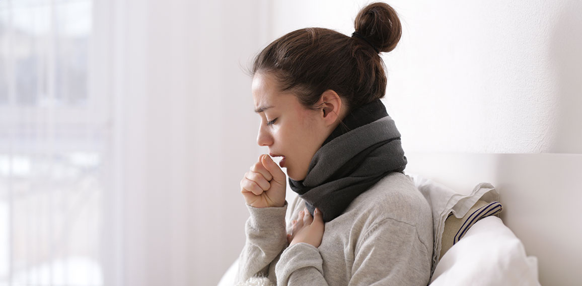 Young ill woman in bed at home