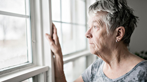 A sad lonely 70 years old senior in is apartment