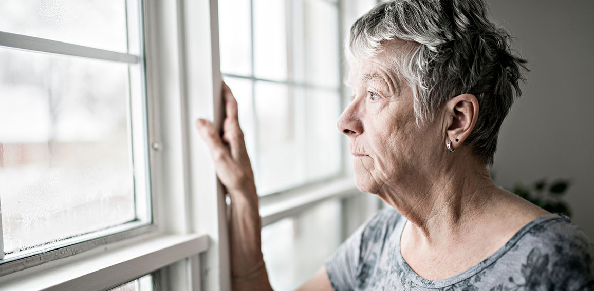 A sad lonely 70 years old senior in is apartment