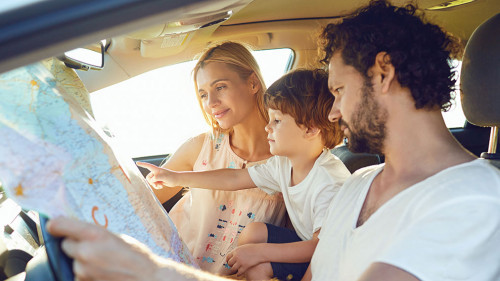 The family travels in the car in the summer