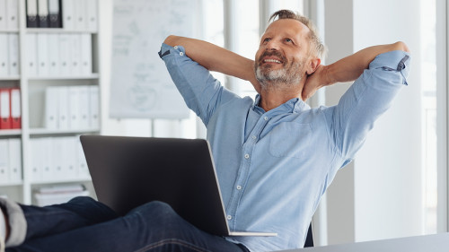 Pleased businessman daydreaming or planning