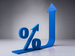 Close-up Of Percentage Symbol On Red Arrow