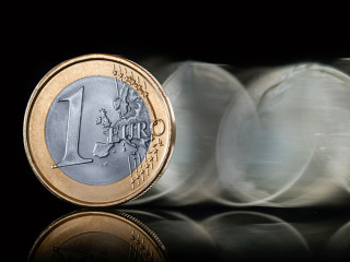 euro coin spin on dark background