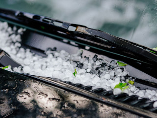 Large hail ice balls on car hood
