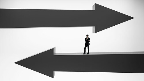 Businessman on black arrows