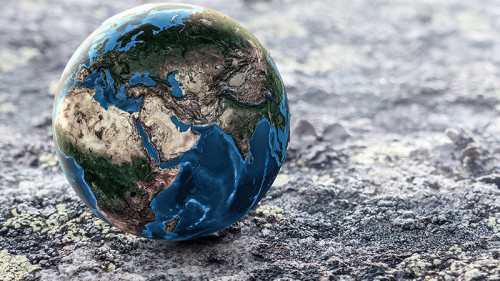 Erdkugel-auf-Gestein-214498289-FO-Sergey-Nivens