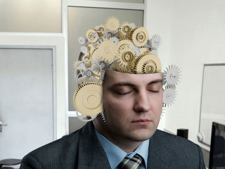 Zahnraeder-in-Anzugtraeger-Kopf-77245347-FO-Nomad-Soul