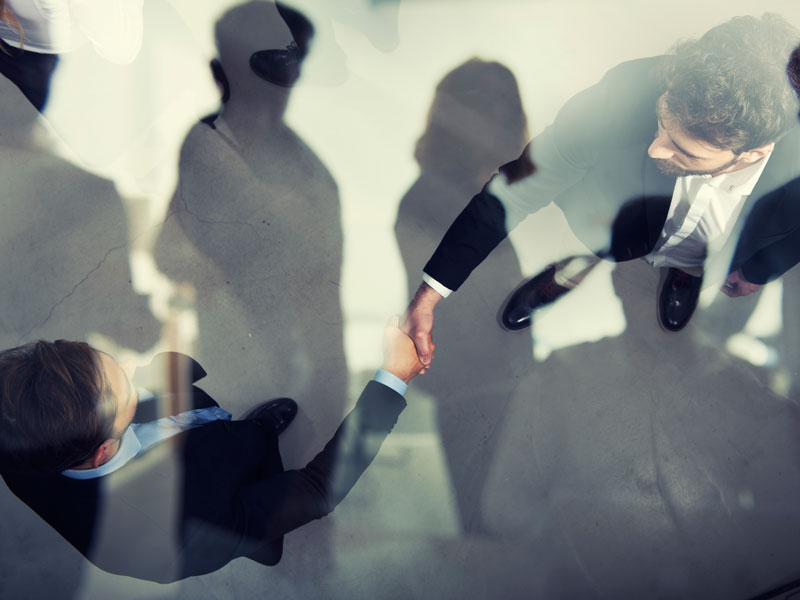 Handshaking Business-Fotolia-222943646-alphaspirit.jpg