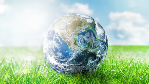 Erdkugel-auf-Wiese-262420833-AS-alphaspirit