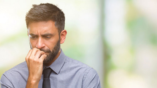 Anzugtraeger-besorgt-240482812-AS-Krakenimages-com