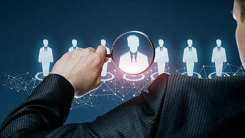 Anzugtraeger-Lupe-255206177-AS-natali-mis