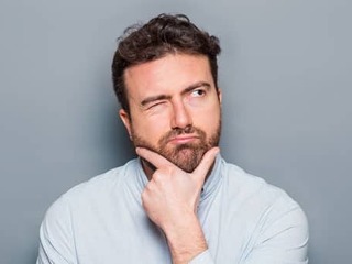 One man portrait isolated on gray background