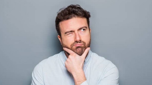 One man portrait isolated on gray background