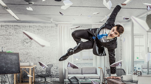 Anzugtraeger-springt-Papier-118820355-AS-Sergey-Nivens