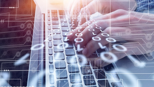 Haende-Laptop-Binaer-Code-270183709-AS-BillionPhotos-com