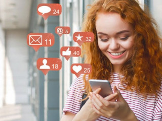 Blogger using phone with social media notification icons