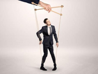 Puppet businessman leaded by a huge hand