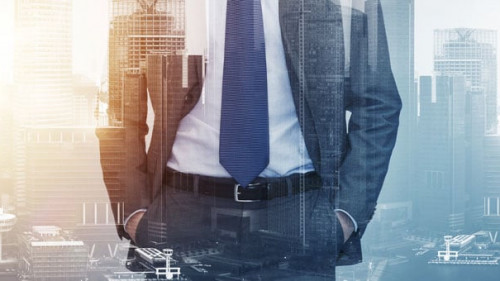 close up of businessman over city buildings