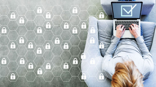 Cyber security concept with man using a laptop