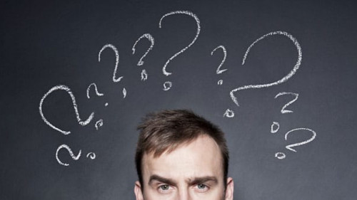 businessman with question marks