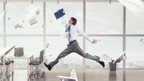 Jumping businessman in office . Mixed media