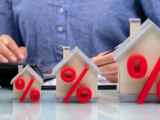 Row Of Increasing House Models On Desk