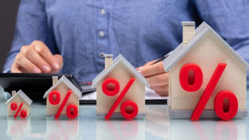 Row Of Increasing House Models On Desk
