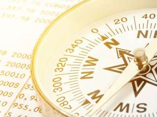 Conceptual compass on account book for finance
