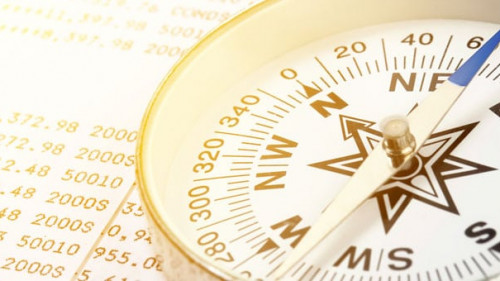 Conceptual compass on account book for finance