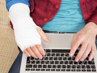 Working on laptop with injured hand