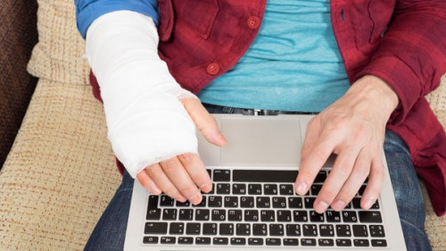 Working on laptop with injured hand