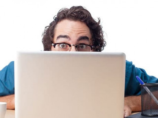 surprised businessman with laptop