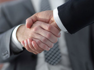 Business men giving a handshake. Business concept