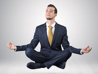 Businessman meditates in an empty space concept