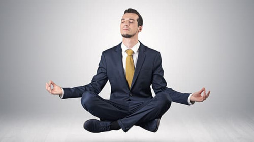 Businessman meditates in an empty space concept