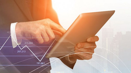 businessman with digital tablet and forex graphs