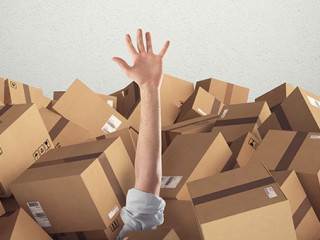 Man buried by a stack of cardboard boxes. 3D Rendering