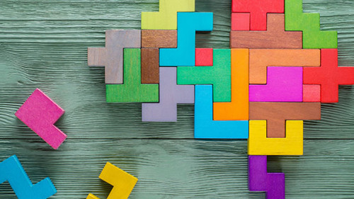 Human brain is made of multi-colored wooden blocks. Creative med